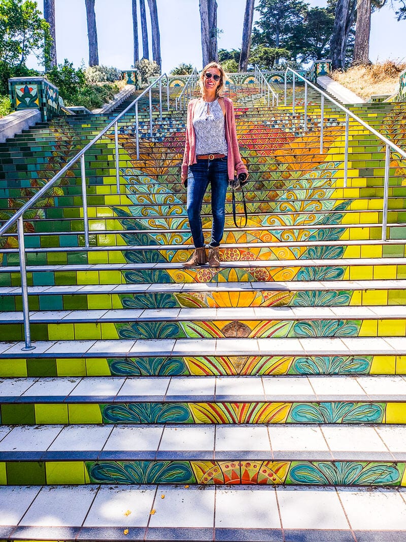 lady on stairs covered in mosaic tiles in san francisco