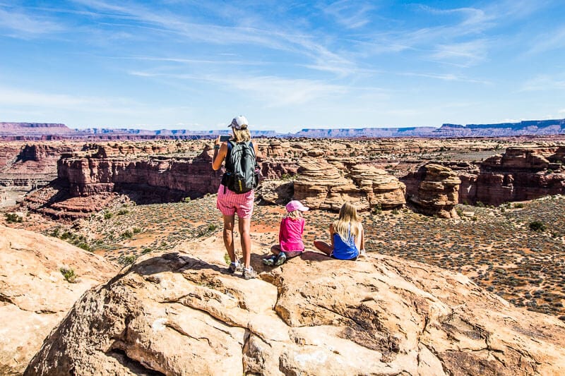 people standing on boulders