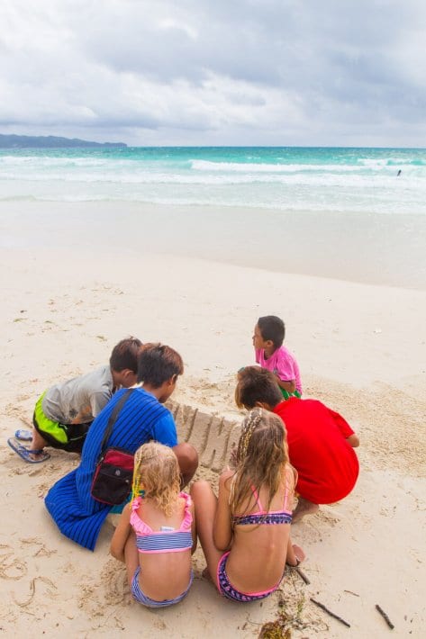 kids building sandcastles