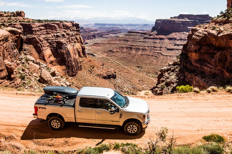 A car parked on the side of a rocky mountain