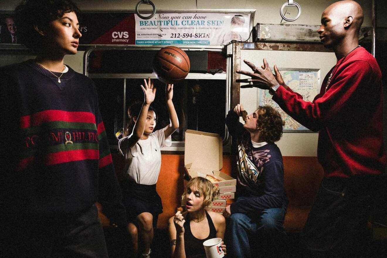 A lively scene from Uptown Bar, capturing a group of friends enjoying a game of basketball, with a mix of focus and laughter in a vibrantly lit urban setting.