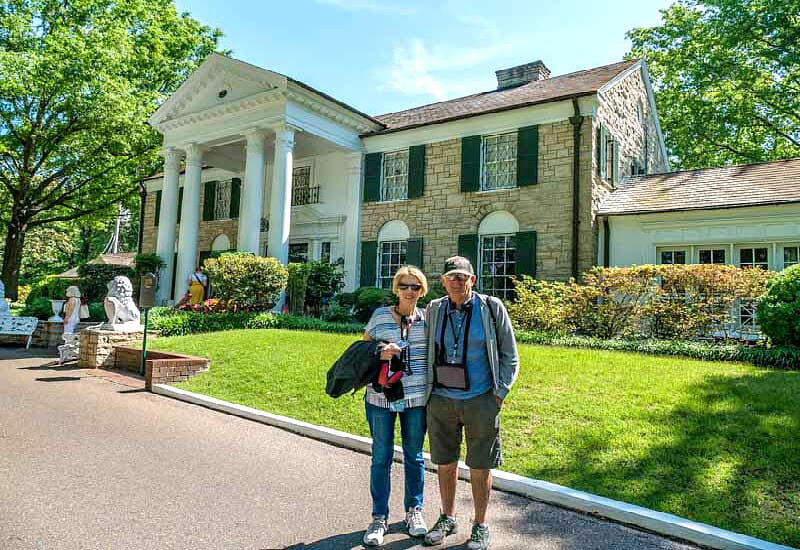 older couple posing in front of Gracelands in Memphis