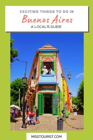 colorful house with statue on the balcony