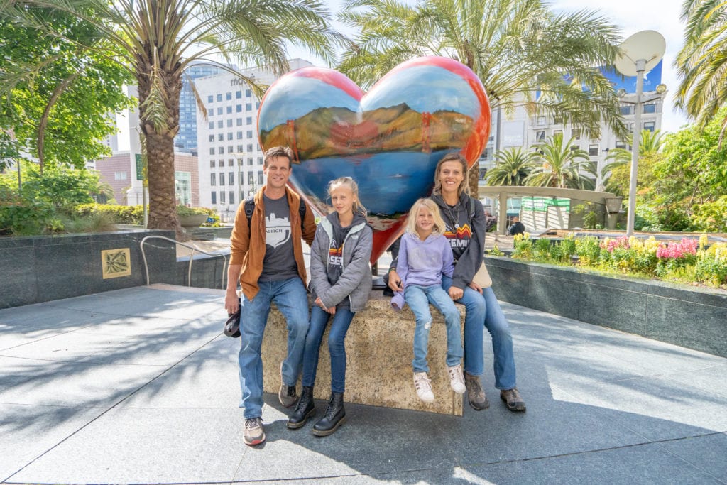 people sitting in front of san francisco heart