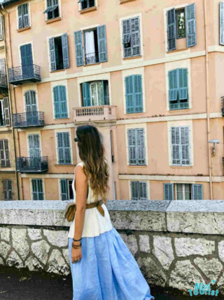 The writer of the post explores the narrow, sunlit corridors between ancient stone walls in Saintes-Maries-de-la-Mer, France