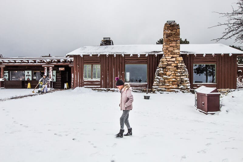 girl walking on snow Grand Canyon