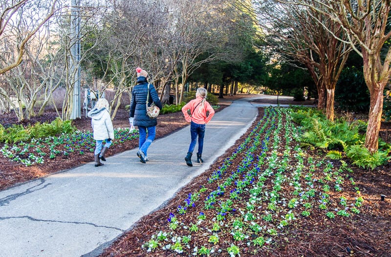 woman and kids walking through Huntsville Botanical Gardens