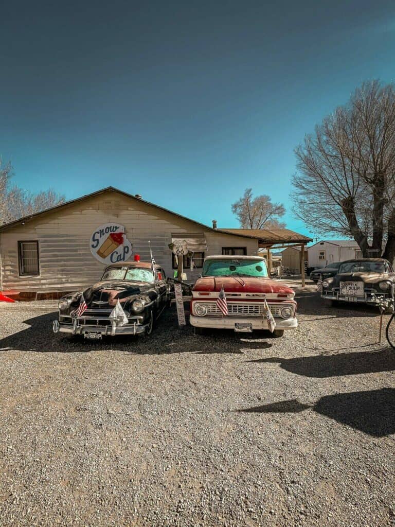 old cars outside gas station in Seligman