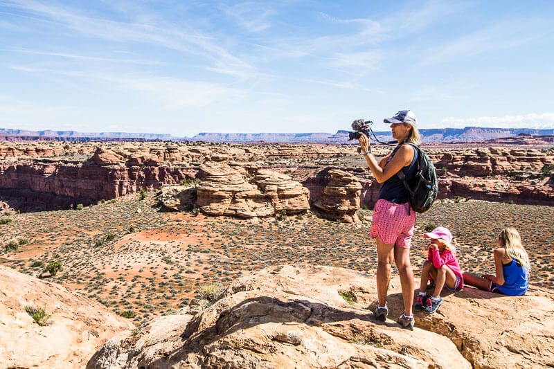 people standing on boulders