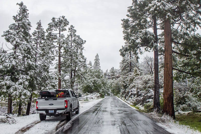 truck on snowy road in yosemite